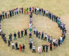 FCC students make human peace sign